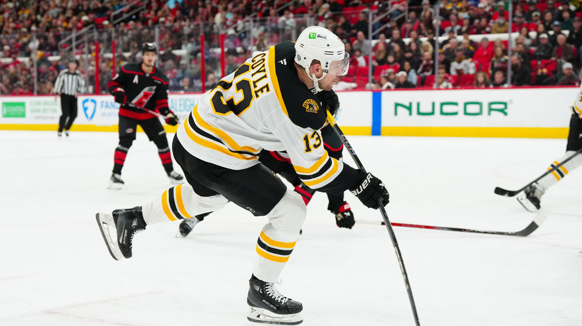 Boston Bruins center Charlie Coyle (13) takes a shot ]against the Carolina Hurricanes during the second period at Lenovo Center. 