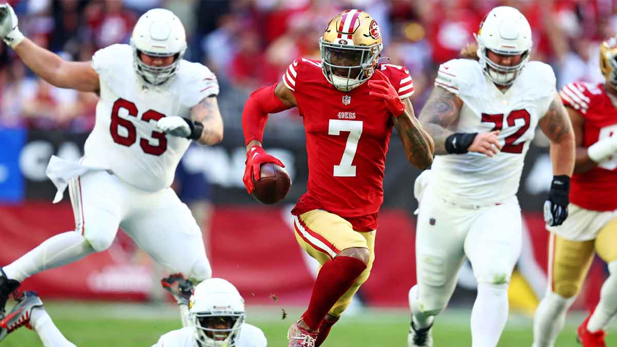 Dec 17, 2023; Glendale, Arizona, USA; San Francisco 49ers cornerback Charvarius Ward (7) runs back an interceptions for a touchdown during the first quarter against the Arizona Cardinals at State Farm Stadium. 