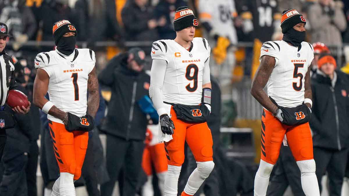 Cincinnati Bengals wide receiver Ja'Marr Chase (1), quarterback Joe Burrow (9) and wide receiver Tee Higgins (5) take the field as captains for the coin toss before the first quarter of the NFL Week 18 game between the Pittsburgh Steelers and the Cincinnati Bengals at Acrisure Stadium in Pittsburgh on Saturday, Jan. 4, 2025.