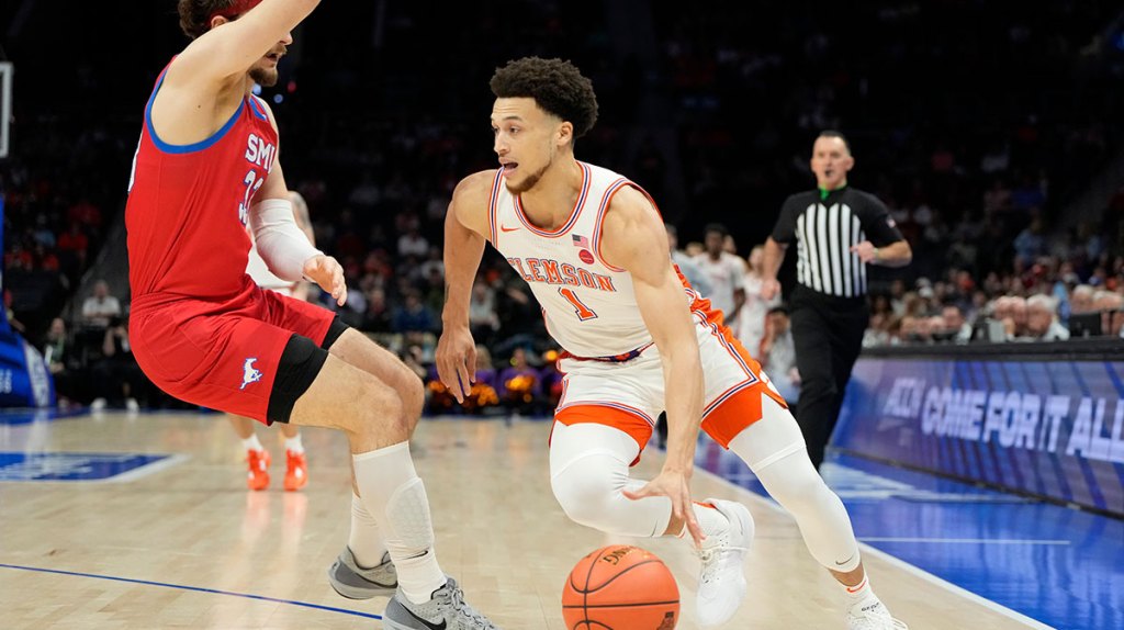 Clemson Tigers guard Chase Hunter (1) dribbles as Southern Methodist Mustangs forward Matt Cross (33) defends in the first half at Spectrum Center.