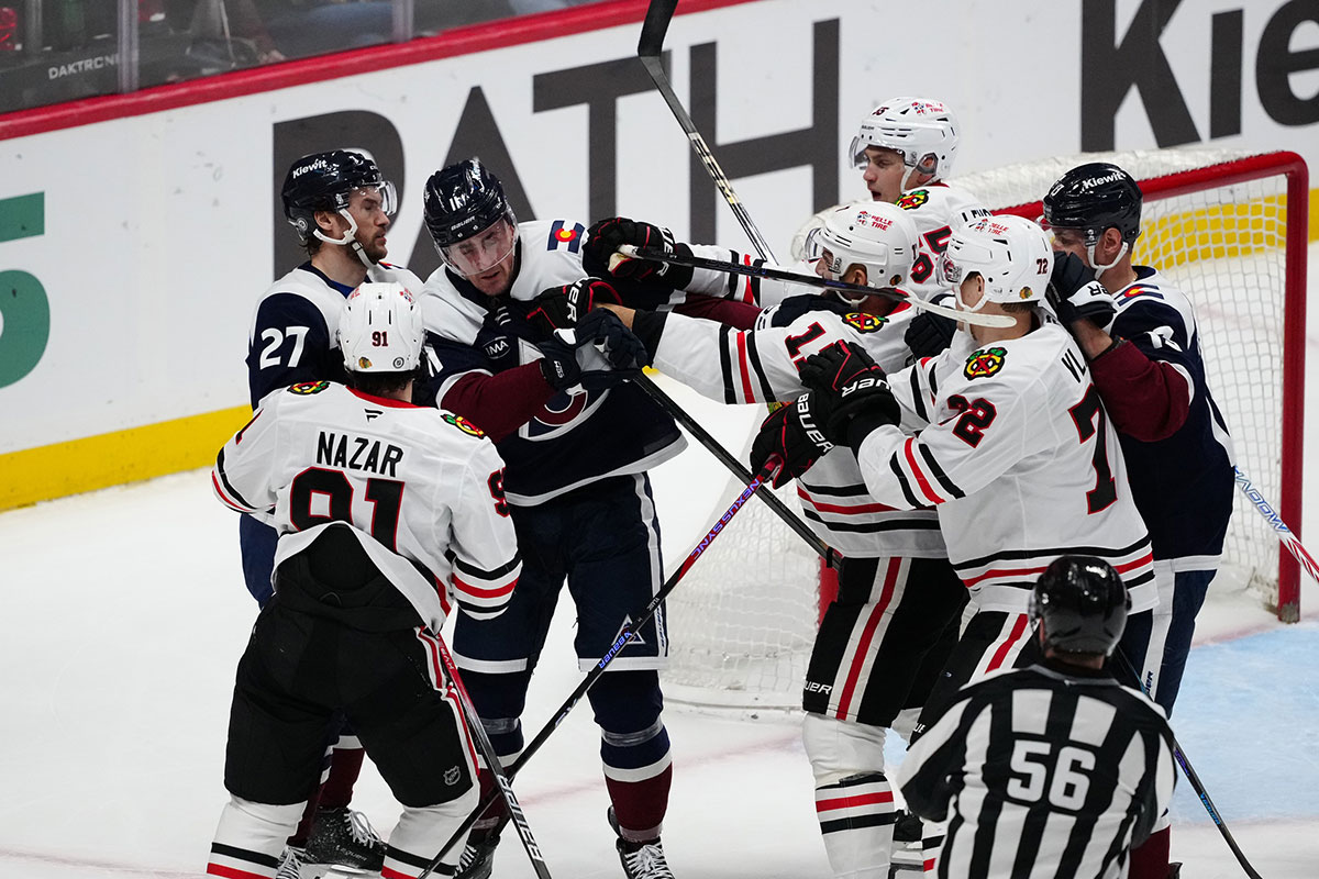 Chicago Blackhawks Left Wing Nick Foligno (17) and Colorado Avalanche Center Brock Nelson (11) is fighting in the Ball Arena in the third period.