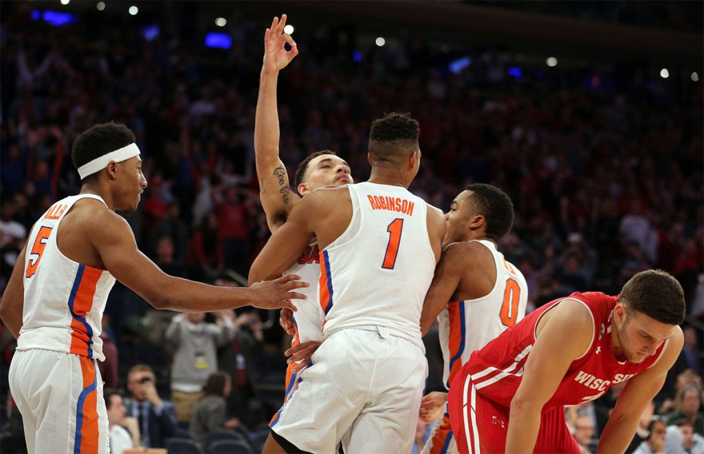 Florida Gators guard Chris Chiozza (11) celebrates making the game winning shot against the Wisconsin Badgers in the semifinals of the East Regional of the 2017 NCAA Tournament at Madison Square Garden.
