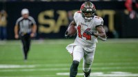 Tampa Bay Buccaneers wide receiver Chris Godwin (14) runs in for a touchdown during the third quarter against the New Orleans Saints at Caesars Superdome.