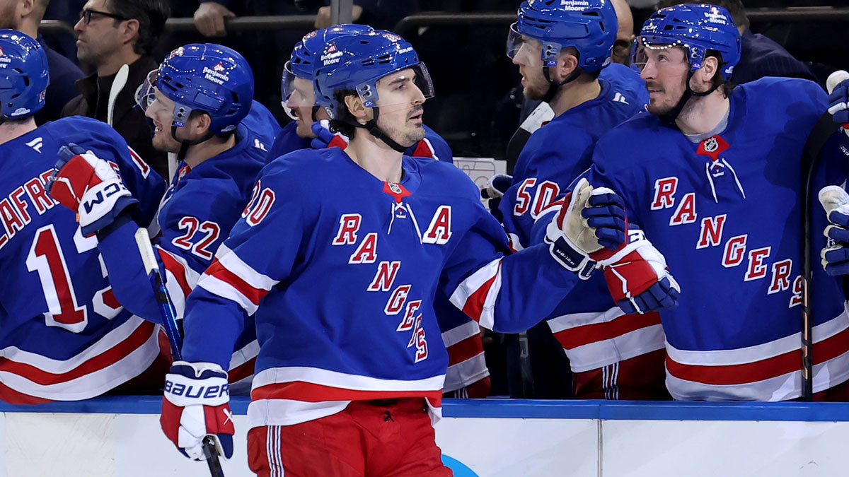 New York Rangers left wing Chris Kreider (20) celebrates his short handed goal against the Boston Bruins with teammates during the third period at Madison Square Garden.