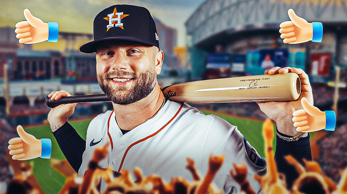 Christian Walker in an Astros jersey with thumbs up around him.