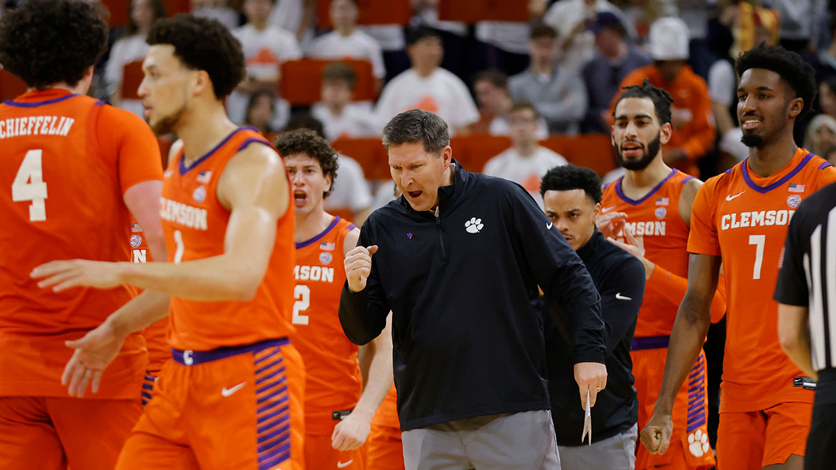 Clemson Tigers Chief Coach Brad Brownell (center) celebrates with players in the field during the second half against Virginia Cover at John Paul Jones Arena. 