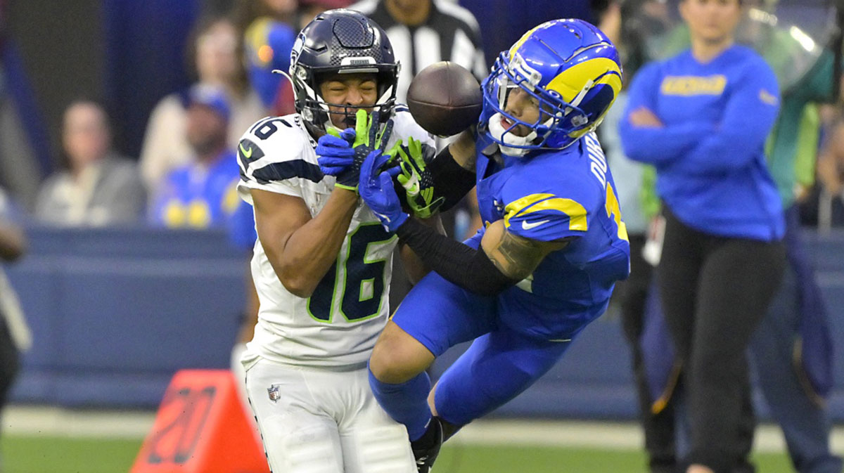 Jan 5, 2025; Inglewood, California, USA; Los Angeles Rams cornerback Cobie Durant (14) breaks up a pass for Seattle Seahawks wide receiver Tyler Lockett (16) in the second half at SoFi Stadium.