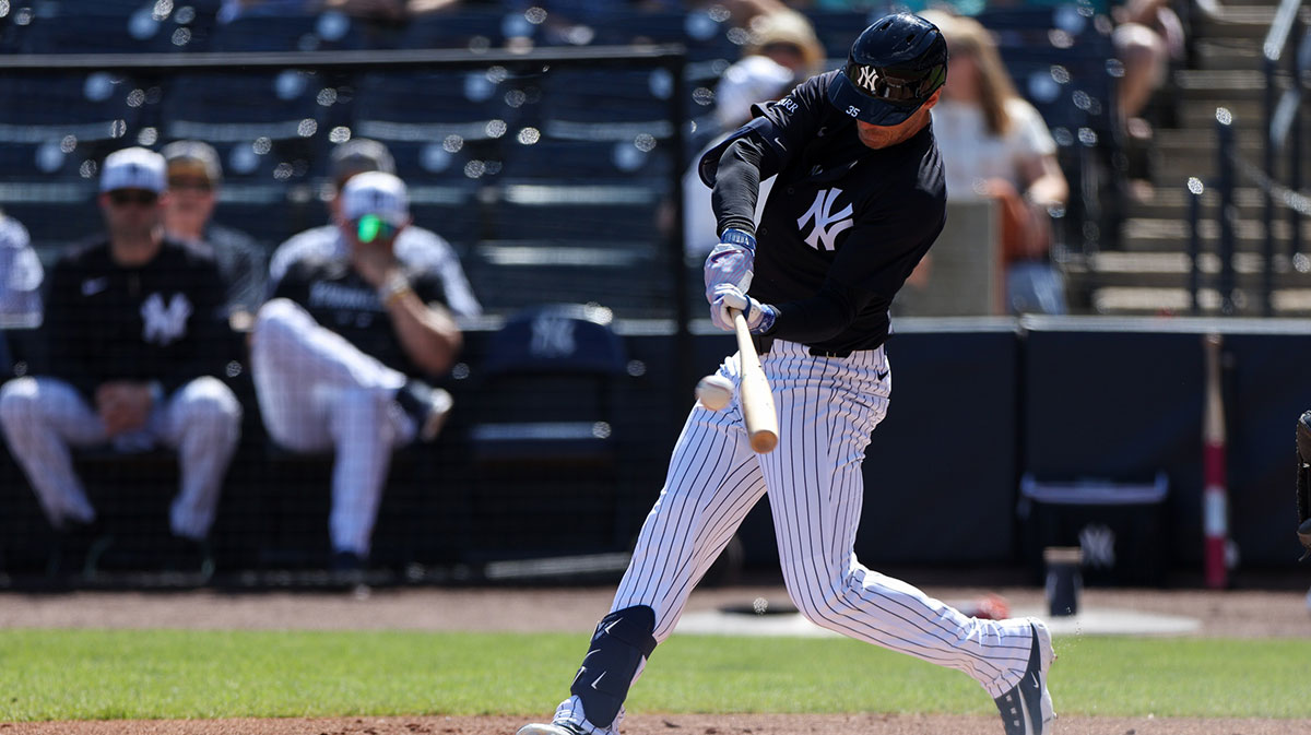 Feb 23, 2025; Tampa, Florida, USA; New York Yankees outfielder Cody Bellinger (35) hits a base hit against the Detroit Tigers in the first inning during spring training at George M. Steinbrenner Field.