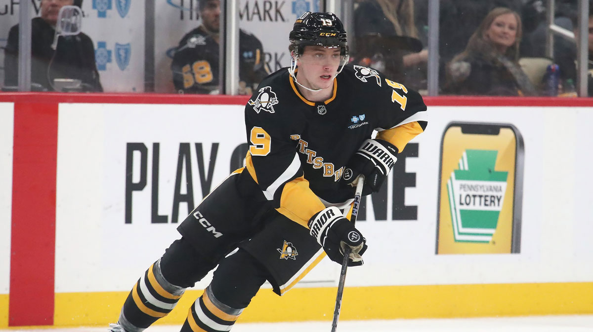 Pittsburgh Penguins center Cody Glass (19) skates up ice with the puck against the New Jersey Devils during the third period at PPG Paints Arena.