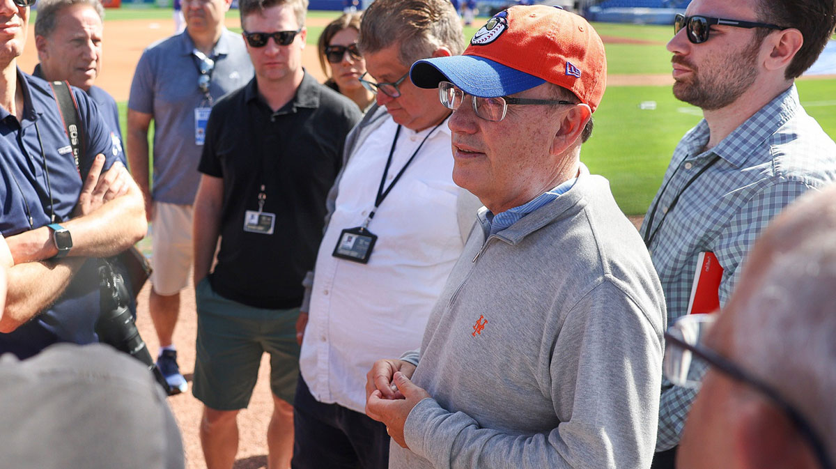 New York Mets owner Steve Cohen (second from right) talks with reporters during the first day of a full-squad workout during Spring Training at Clover Park on Monday, Feb. 17, 2025, in Port St. Lucie.