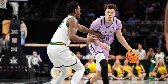 Kansas State Wildcats guard Coleman Hawkins (33) brings the ball up court around Baylor Bears guard Jalen Celestine (32) during the second half at T-Mobile Center.