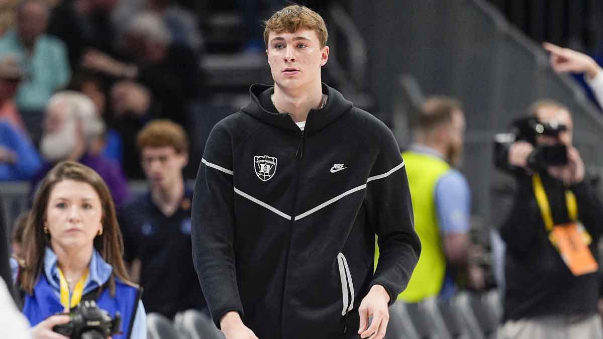 Duke Blue Devils forward Cooper Flagg (2) walks to the bench during the first half against the North Carolina Tar Heels at Spectrum Center.
