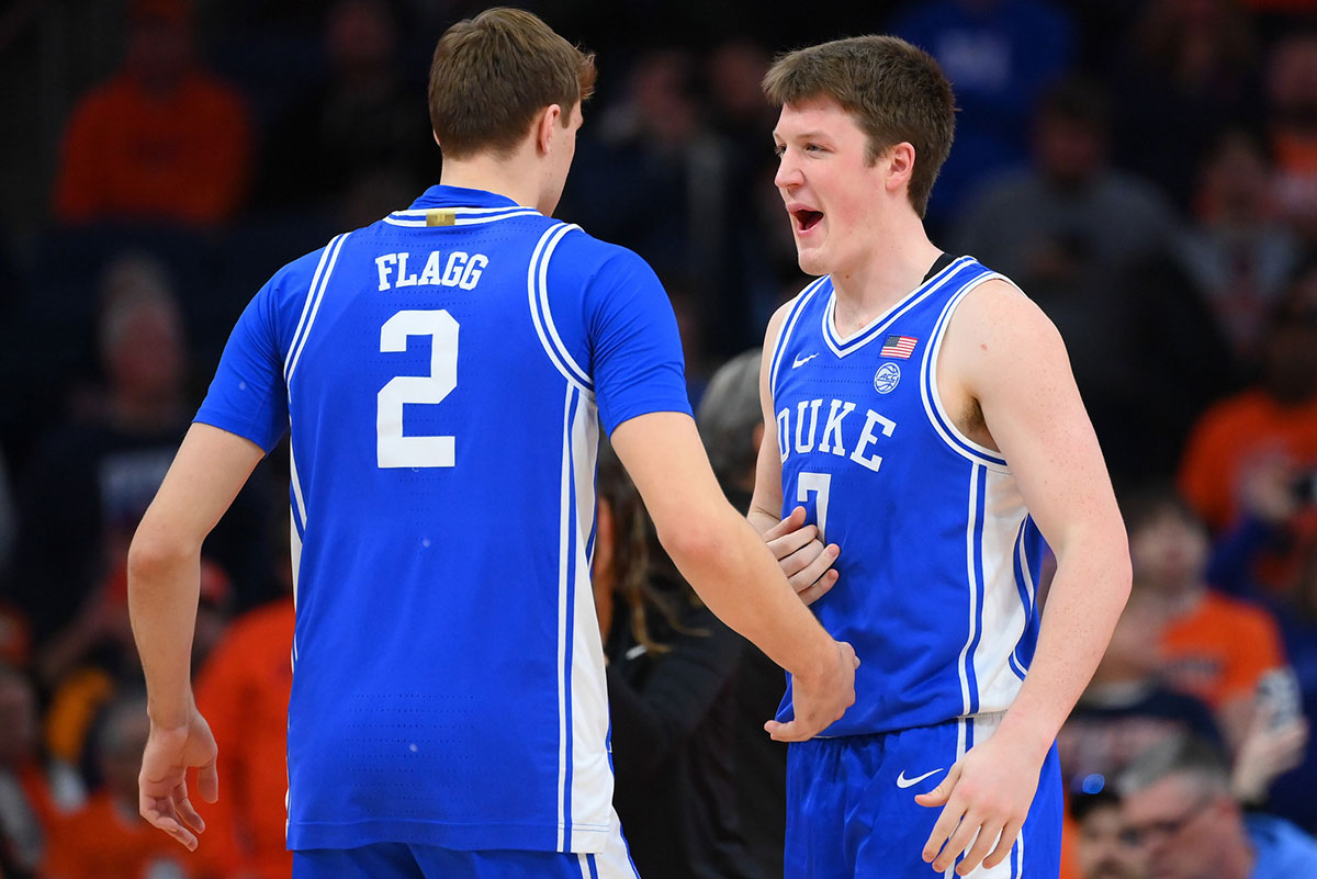 Duke Blue Devils guard Cooper Flagg (2) and guard Kon Knueppel (7) meet prior to the game against the Syracuse Orange at the JMA Wireless Dome.