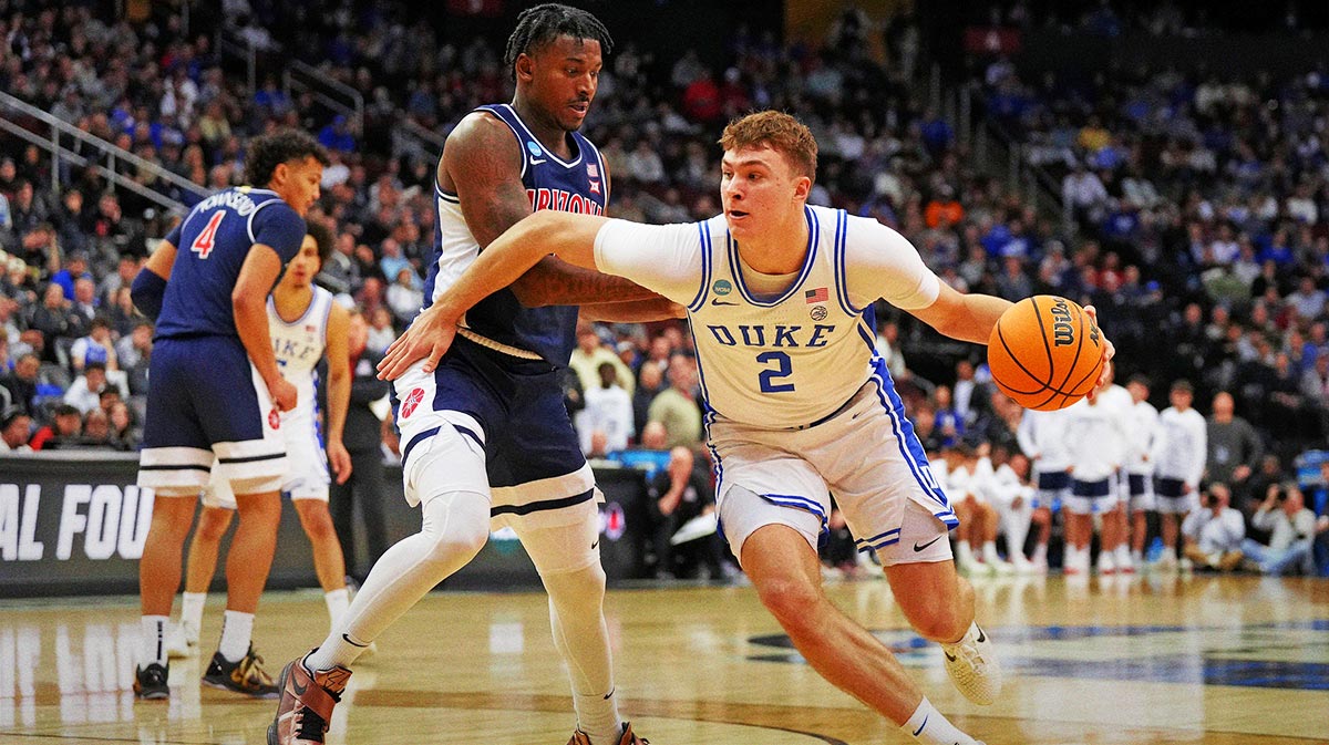 Duke Blue Devils forward Cooper Flagg (2) drives to the basket against Arizona Wildcats guard Jaden Bradley (0) during the second half during an East Regional semifinal of the 2025 NCAA tournament at Prudential Center.