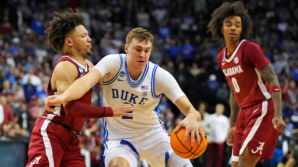 Duke Blue Devils forward Cooper Flagg (2) drives to the basket against Alabama Crimson Tide guard Mark Sears (1) during the second half in the East Regional final of the 2025 NCAA tournament at Prudential Center. Mandatory Credit: Robert Deutsch-Imagn Images