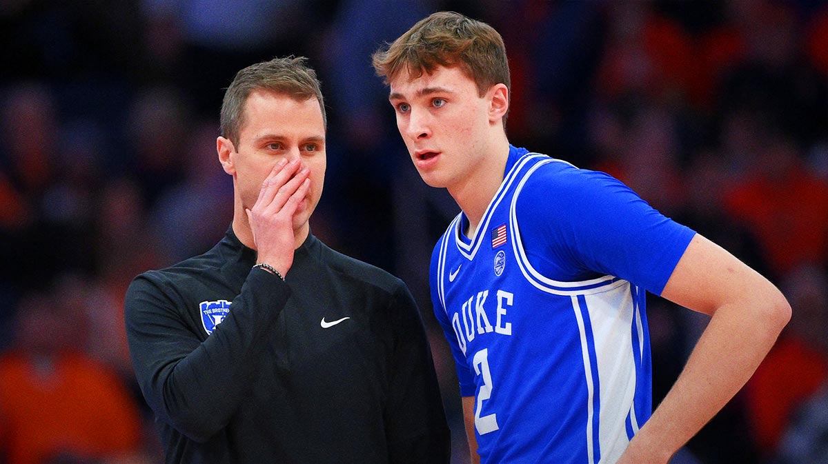 Duke Blue Devils head coach Jon Scheyer talks with guard Cooper Flagg (2) against the Syracuse Orange during the first half at the JMA Wireless Dome.