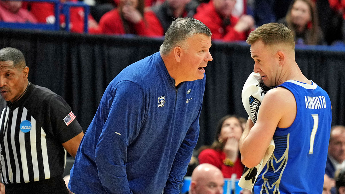 Creighton Bluejays head coach Greg McDermott talks with guard Steven Ashworth (1) during the second half against the Louisville Cardinals in the first round of the NCAA Tournament at Rupp Arena