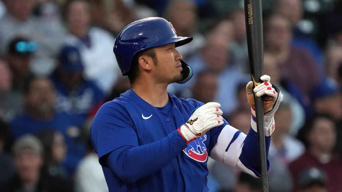 Chicago Cubs outfielder Seiya Suzuki (27) hits against the Kansas City Royals in the first inning at Sloan Park. 