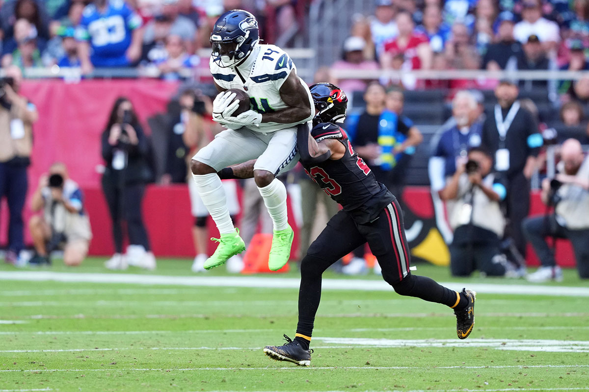 Dec 8, 2024; Glendale, Arizona, USA; Seattle Seahawks wide receiver DK Metcalf (14) makes a catch against Arizona Cardinals cornerback Sean Murphy-Bunting (23) during the second half at State Farm Stadium.