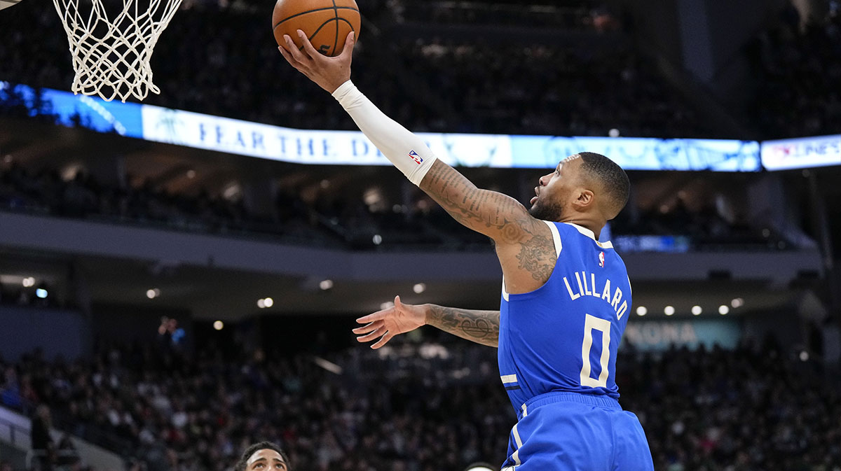 Milwaukee Bucks guard Damian Lillard (0) shoots during the third quarter against the Indiana Pacers at Fiserv Forum.