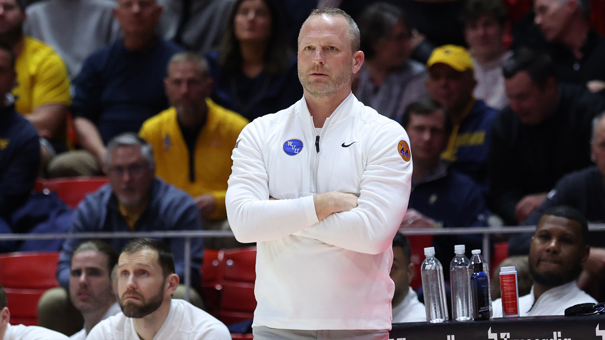 West Virginia Mountaineers head coach Darian DeVries watches the play against the Utah Utes during the first half at Jon M. Huntsman Center.
