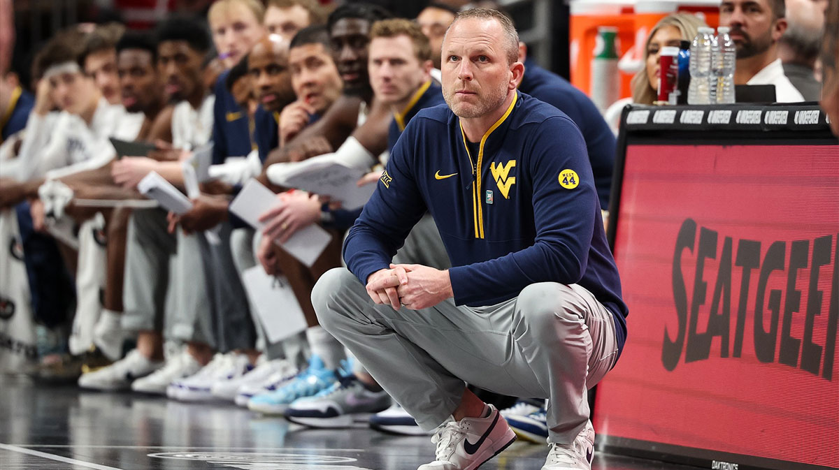 West Virginia Mountaineers coach Darian DeVries watches game play during the first half against the Colorado Buffaloes at T-Mobile Center.