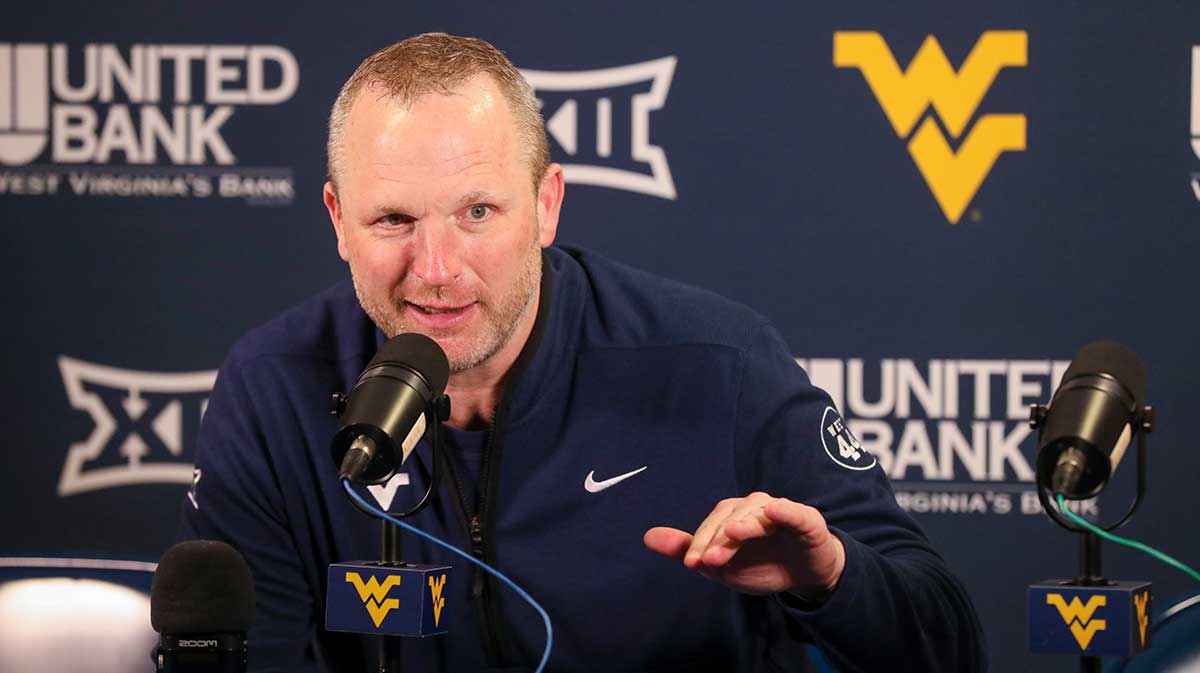 West Virginia Mountaineers head coach Darian DeVries answers questions from the media after defeating the UCF Knights at WVU Coliseum.