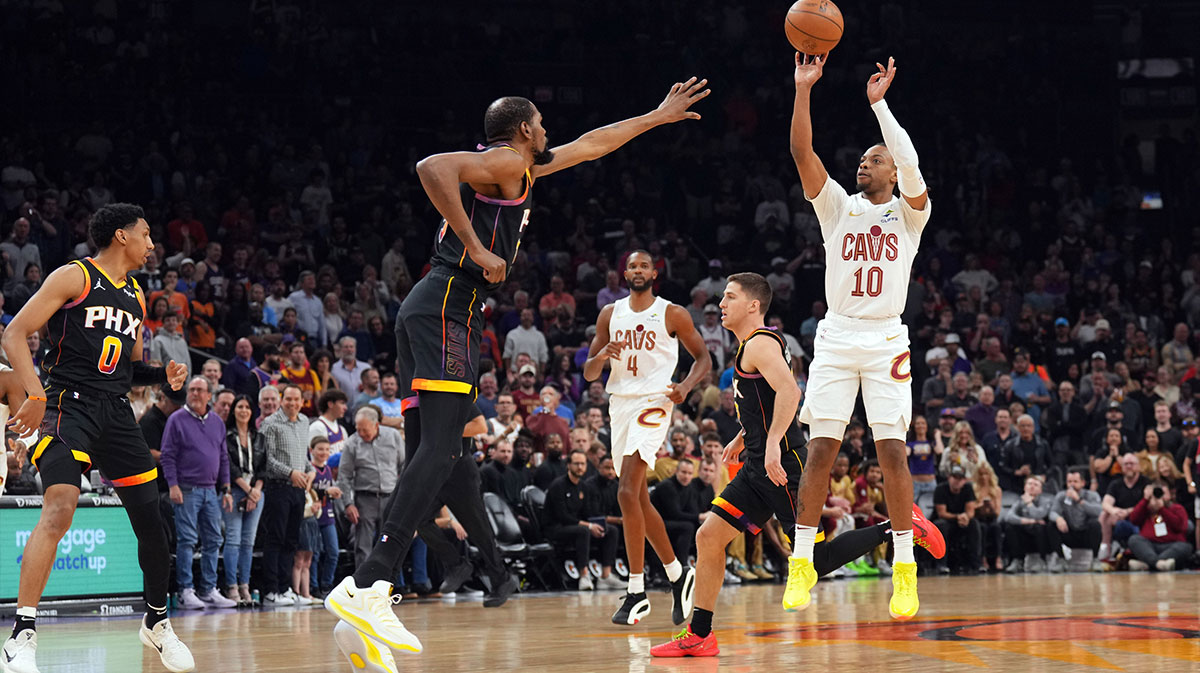 Cleveland Cavaliers guard Darius Garland (10) shoots over Phoenix Suns forward Kevin Durant (35) during the first half at Footprint Center.
