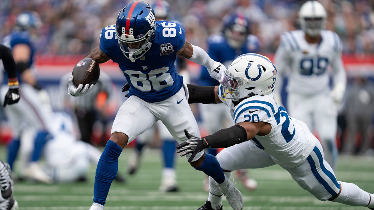 New York Giants wide receiver Darius Slayton (86) breaks a tackle by Indianapolis Colts defensive back Nick Cross (20) during a game between New York Giants and Indianapolis Colts at MetLife Stadium on Sunday, Dec. 29, 2024.
