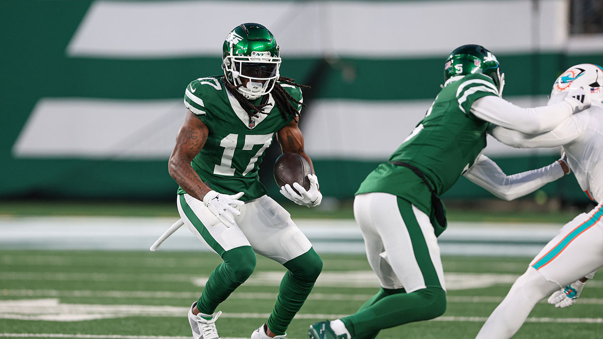 Jan 5, 2025; East Rutherford, New Jersey, USA; New York Jets wide receiver Davante Adams (17) gains yards after catch during the first quarter against the Miami Dolphins at MetLife Stadium.