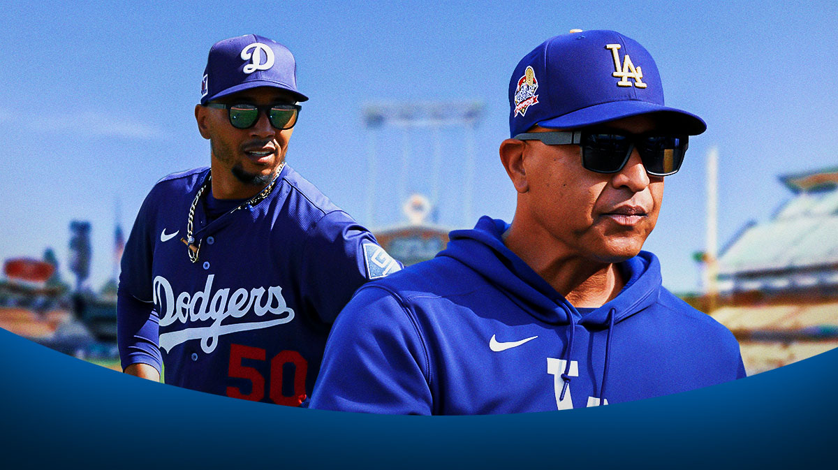 Los Angeles Dodgers manager Dave Roberts next to Mookie Betts in front of Dodger Stadium.