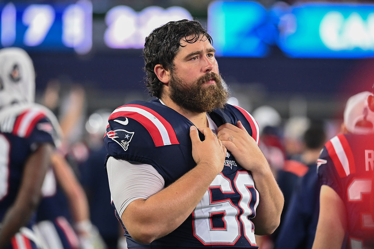 New England Patriots center David Andrews (60) watches from the sideline during the first half against the Carolina Panthers at Gillette Stadium.