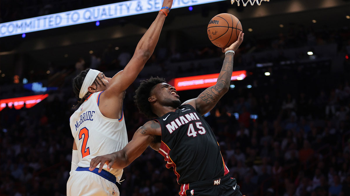 Davion Mitchell driving against Miles McBride during the Knicks-Heat game on March 2, 2025.