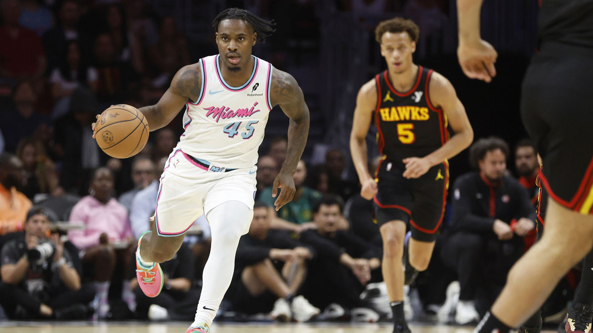 Miami Heat guard Davion Mitchell (45) brings the ball up court in front of Atlanta Hawks guard Dyson Daniels (5) during the fist half at Kaseya Center.