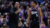 Sacramento Kings head coach Mike Brown talks with guard De'Aaron Fox (5) during the third quarter against the Orlando Magic at Golden 1 Center.