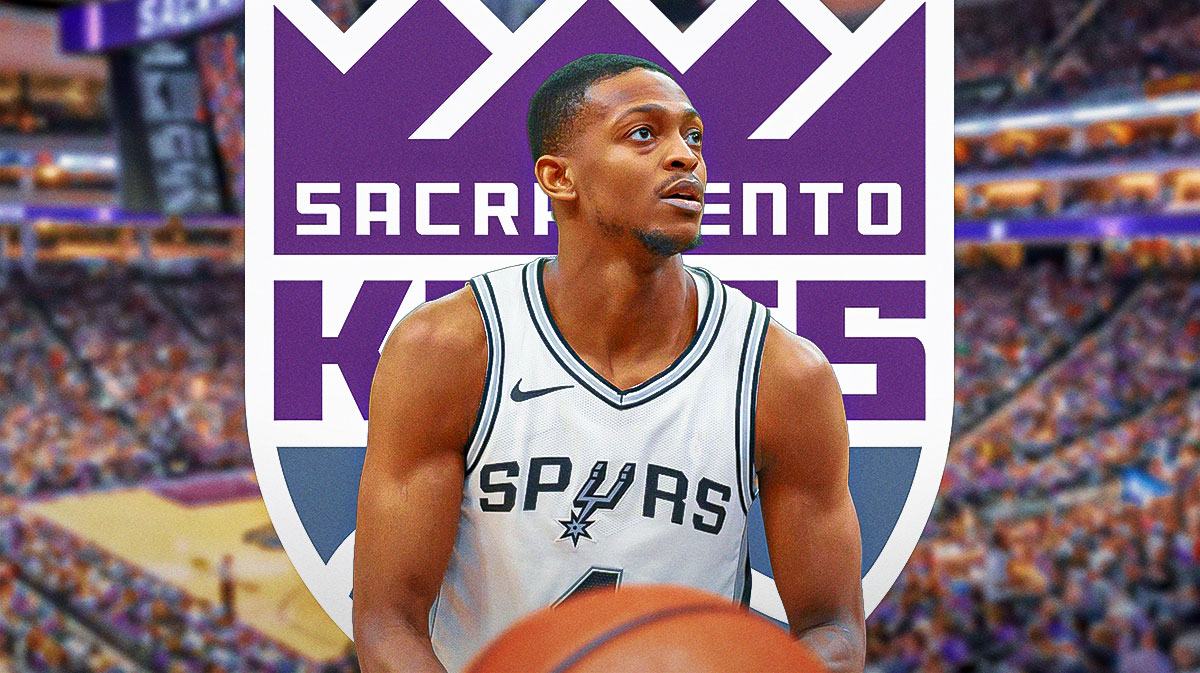 De'Aaron Fox looking serious with the Sacramento Kings logo next to him.