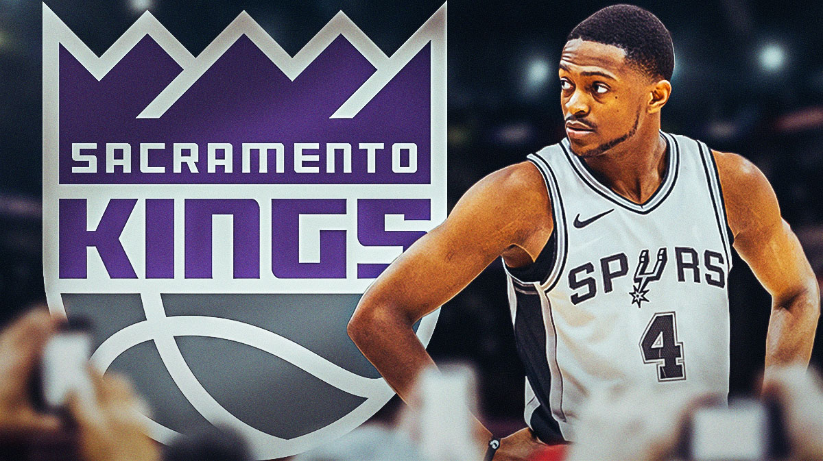 Spurs' De'Aaron Fox looking at a Kings logo