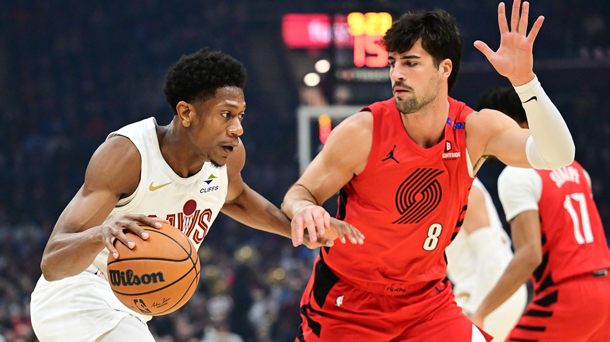 Cleveland Cavaliers forward De'Andre Hunter (12) drives to the basket against Portland Trail Blazers forward Deni Avdija (8) during the first half at Rocket Arena.
