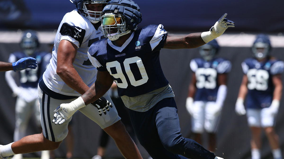 Dallas Cowboys defensive end DeMarcus Lawrence (90) rushes during training camp at the River Ridge Playing Fields in Oxnard, California. Mandatory Credit: Jason Parkhurst-Imagn Images