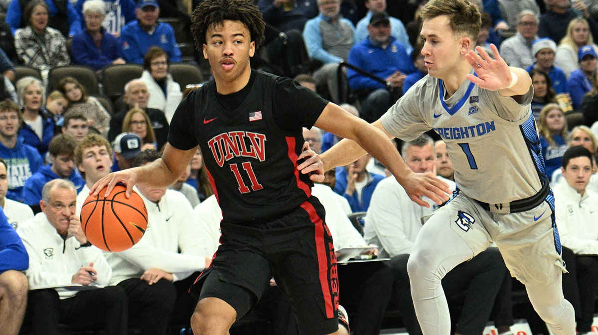 UNLV Rebels guard Dedan Thomas Jr. (11) dribbles against Creighton Bluejays guard Steven Ashworth (1) in the first half at CHI Health Center Omaha.