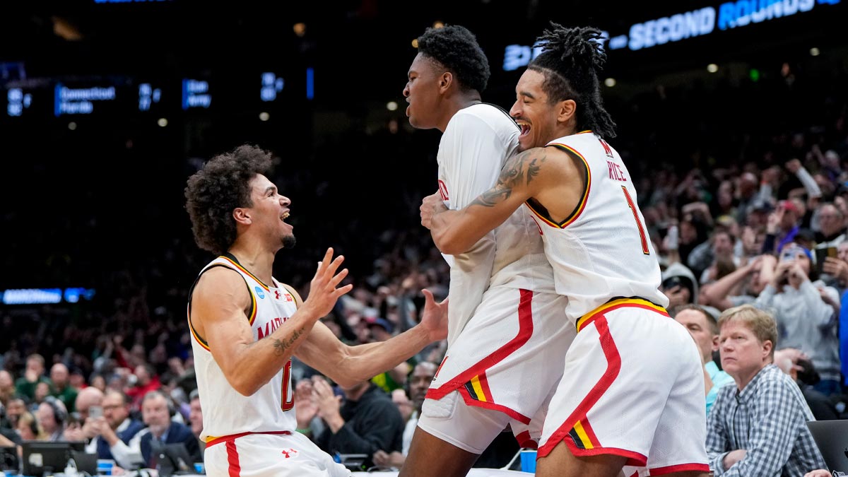 Maryland Terrapins basketball center Derik Queen (25) celebrates with teammates after scoring the game-winning shot against the Colorado State Rams at Climate Pledge Arena.