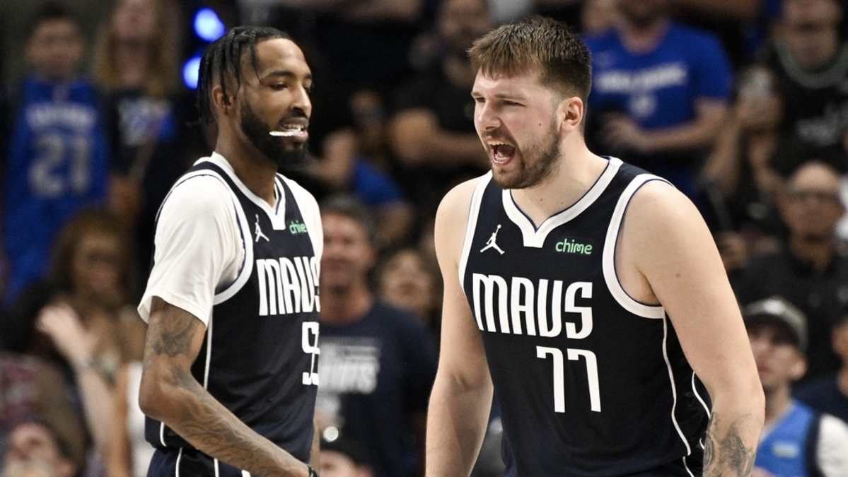 Dallas Mavericks guard Luka Doncic (77) and forward Derrick Jones Jr. (55) reacts to a foul call against the Minnesota Timberwolves during the second half in game three of the western conference finals for the 2024 NBA playoffs at American Airlines Center.