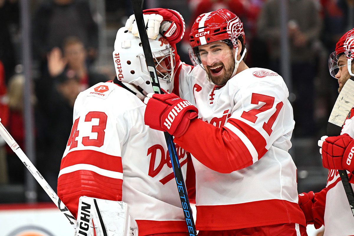 Detroit Red Wings center Dylan Larkin (71) celebrates with goalie Petr Mrazek (43) after the Red Wings defeated the Buffalo Sabres at Little Caesars Arena.