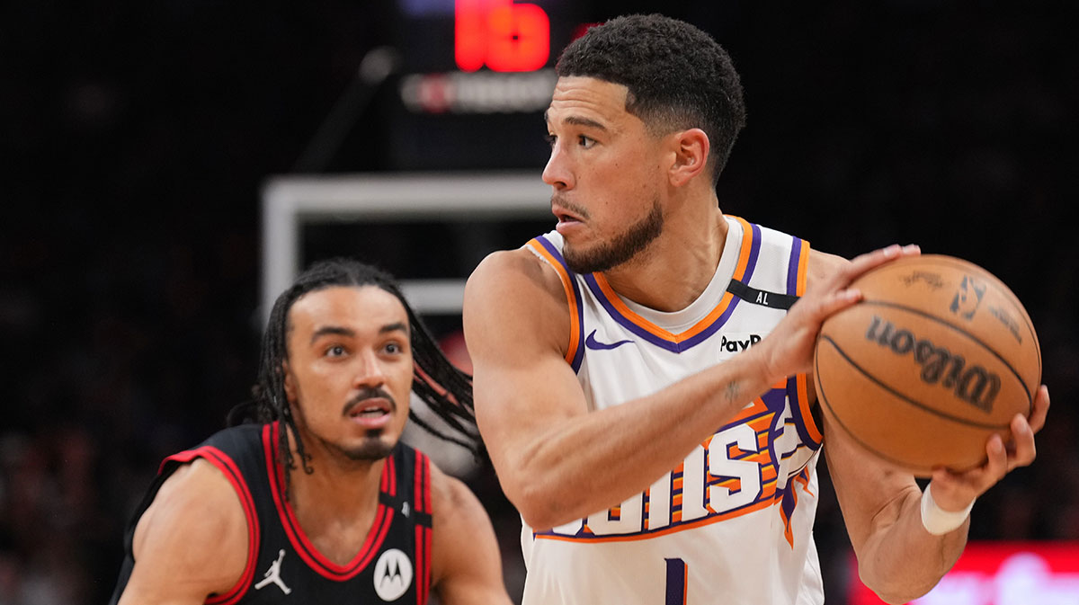 Phoenix Suns guard Devin Booker (1) drives against Chicago Bulls guard Tre Jones (30) during the second half at PHX Arena.