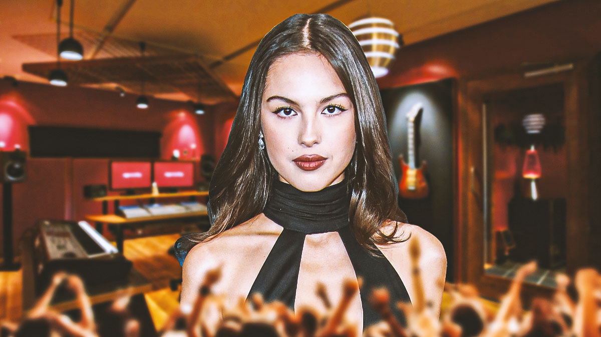 Olivia Rodrigo, who could be teasing new music with latest TikTok post, with music studio background.