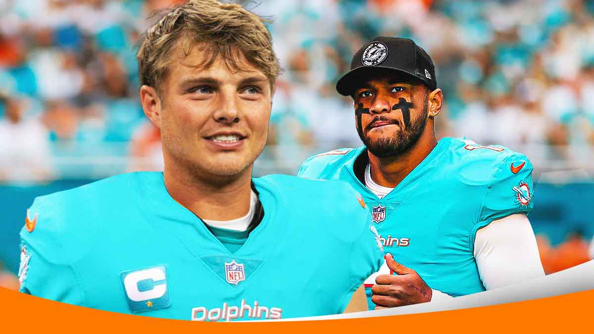 Zack Wilson next to Tua Tagovailoa on the Dolphins field.