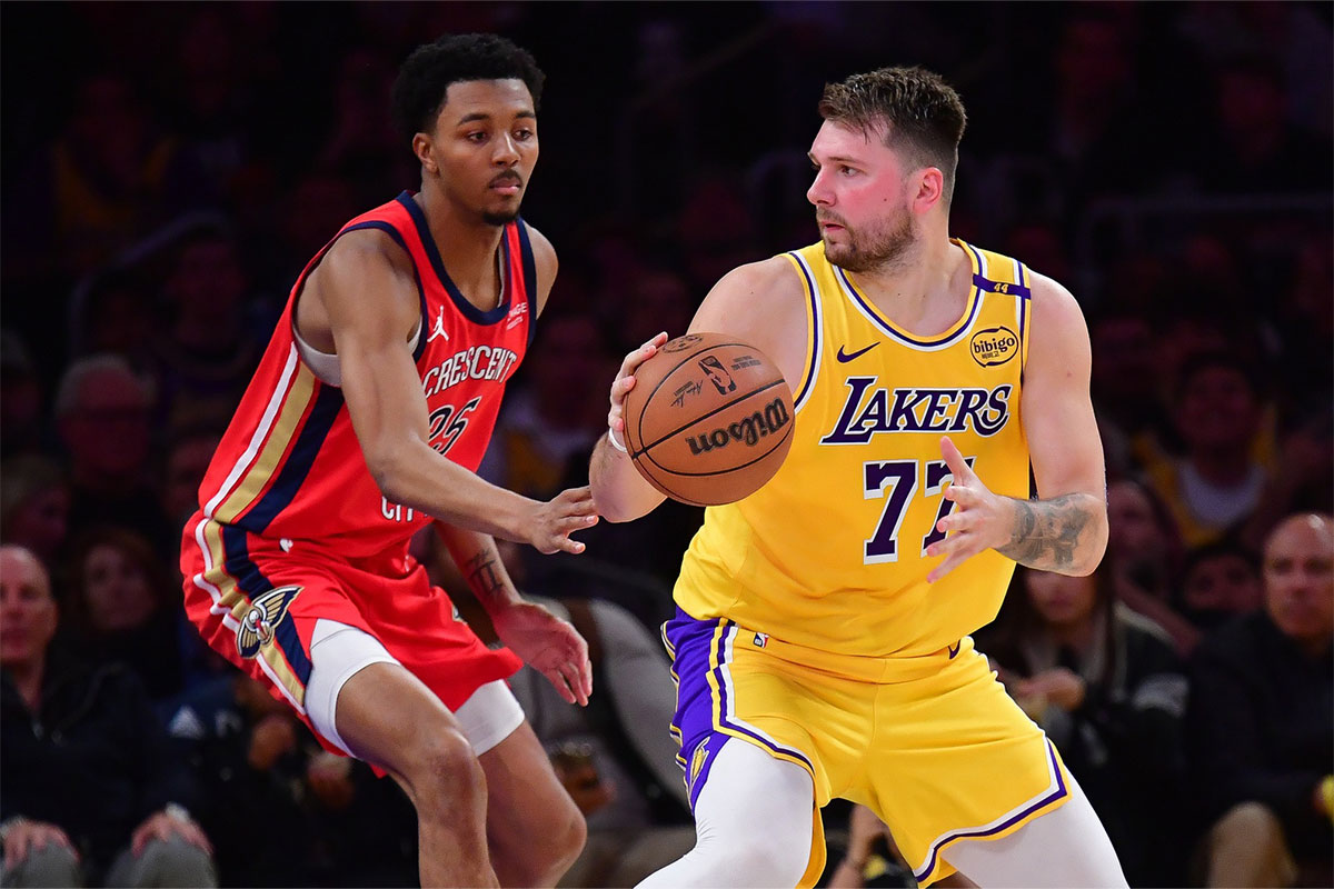 Los Angeles Lakers guard Luka Doncic (77) controls the ball against New Orleans Pelicans guard Trey Murphy III (25) during the second half at Crypto.com Arena