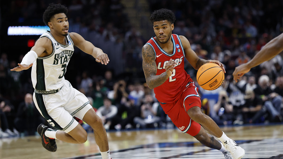 New Mexico Lobos basketball guard Donovan Dent (2) dribbles in the second half against the Michigan State Spartans during the NCAA Tournament Second Round at Rocket Arena.