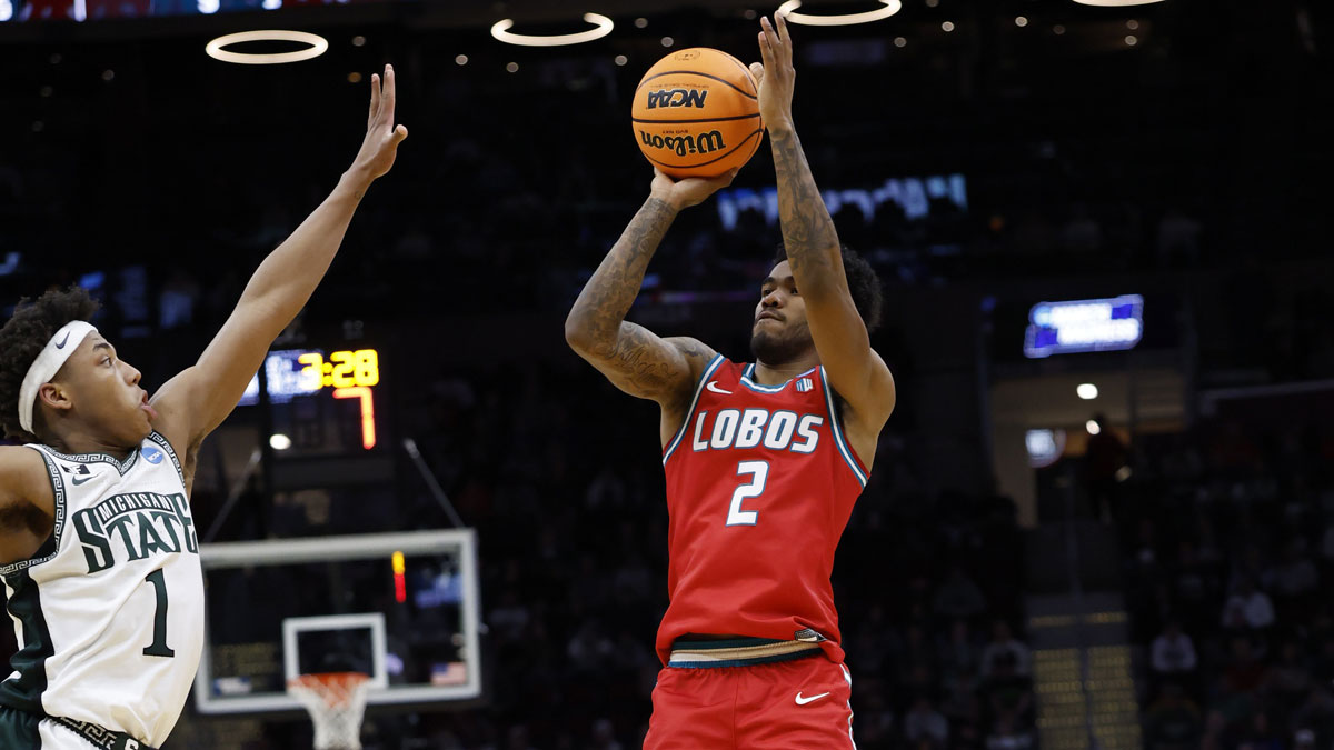 New Mexico Lobos guard Donovan Dent (2) shoots the ball over Michigan State Spartans guard Jeremy Fears Jr. (1) in the second half during the NCAA Tournament Second Round at Rocket Arena.