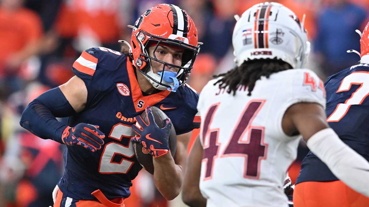 Syracuse Orange wide receiver Trebor Pena (2) tries to avoid a tackle by Virginia Tech Hokies cornerback Dorian Strong (44) in the third quarter at JMA Wireless Dome. 